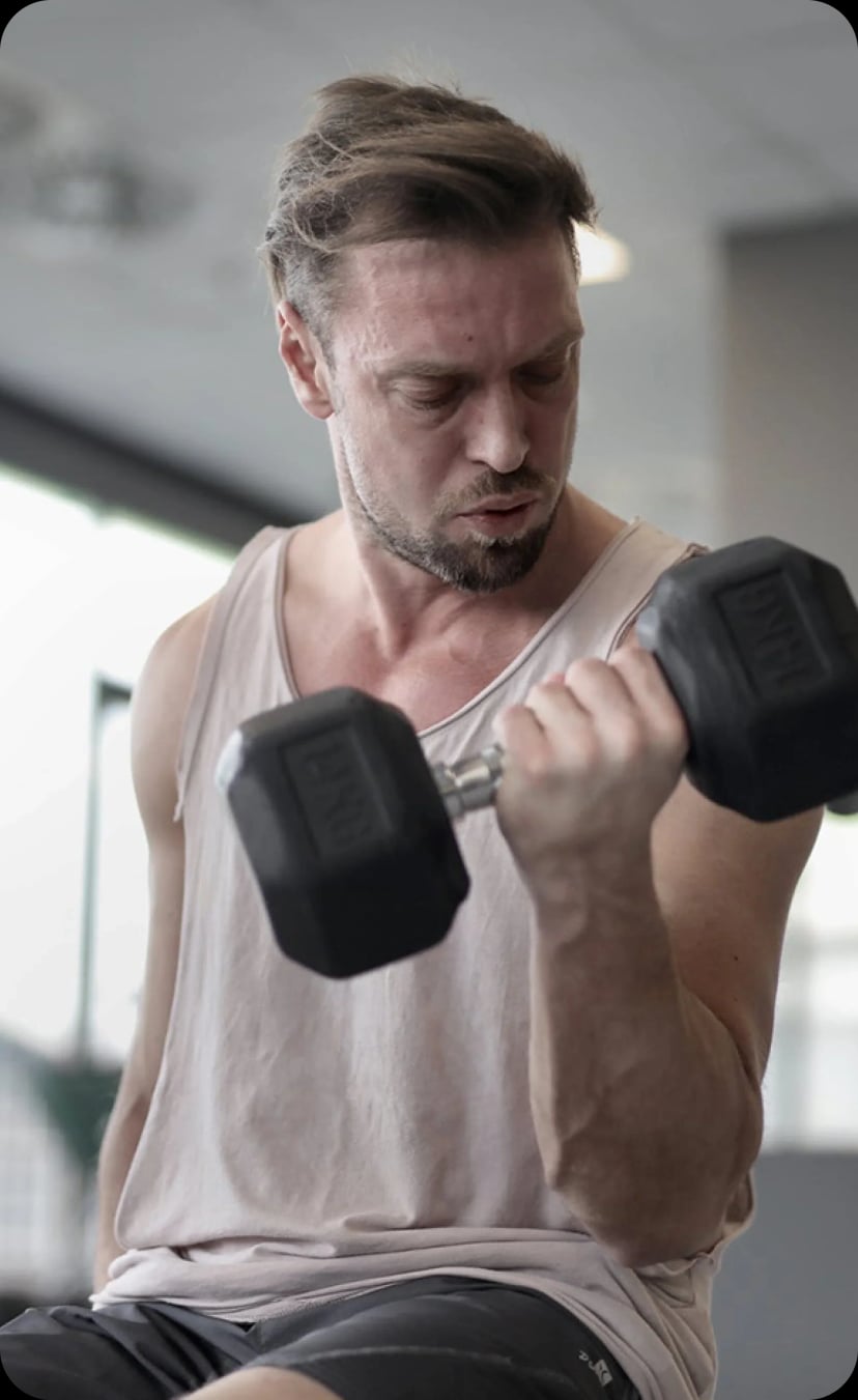 Man doing dumbbell exercises