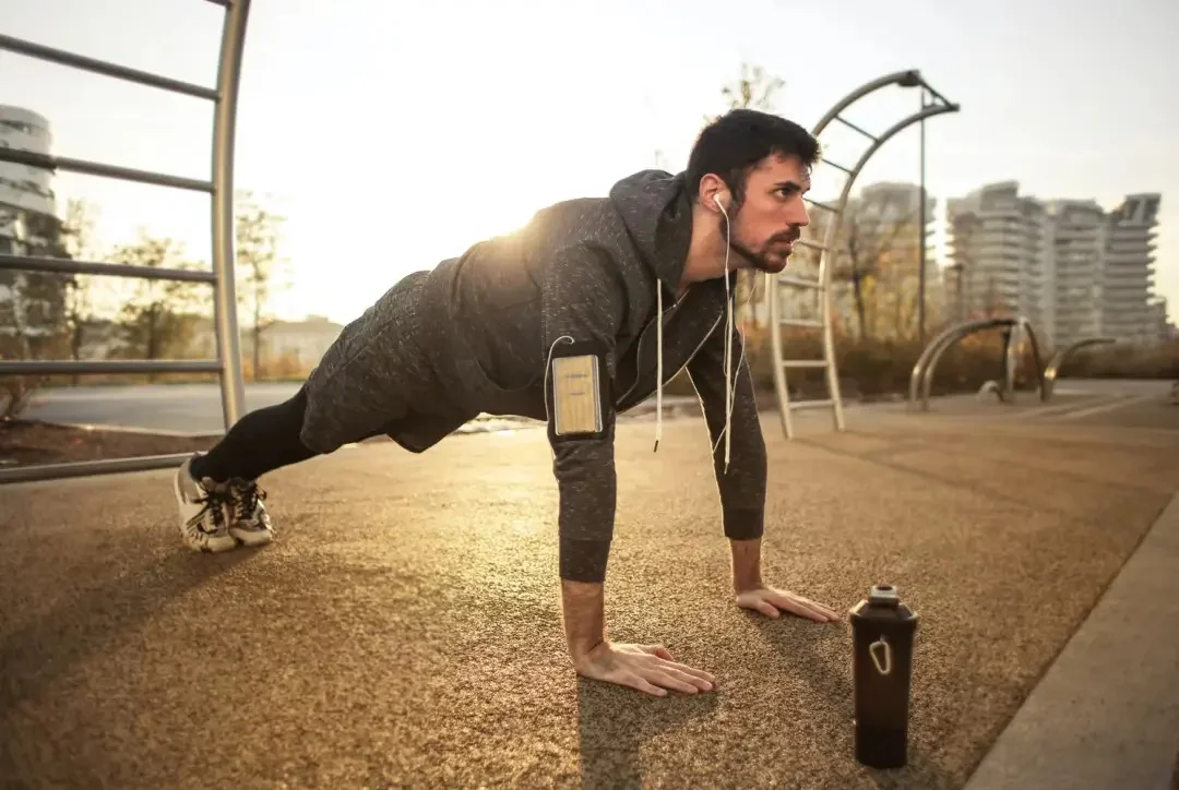 Man doing outdoor exercise with headphones